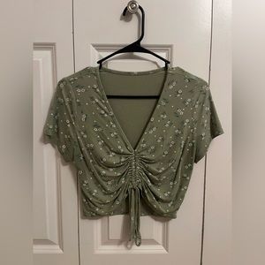 green floral draw string shirt, dry fit material, stretchy, super comfy